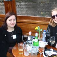 3 women lakers smile and sit on amsterdam boat